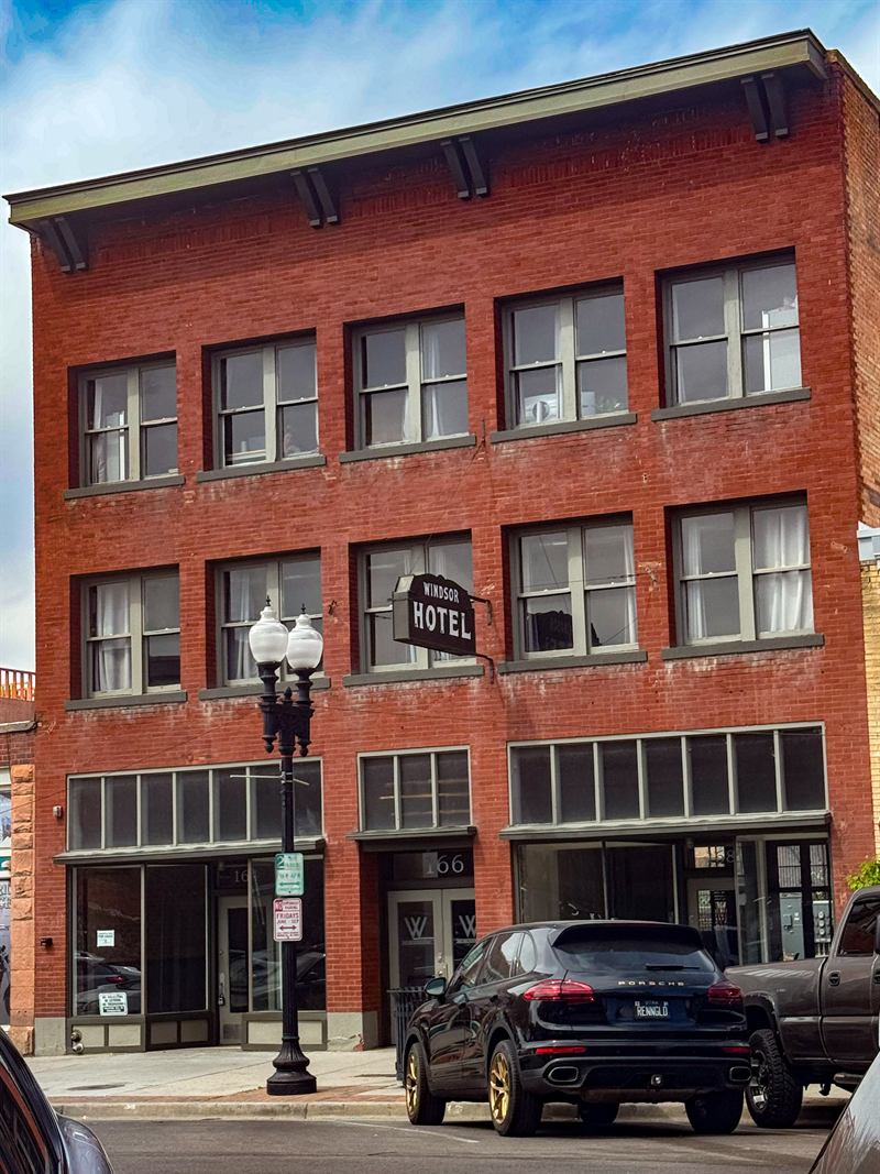Street view of the Windsor Hotel brick building
